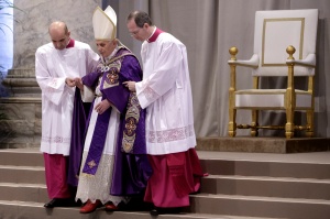 Aides assist pope as he begins Ash Wednesday Mass at Vatican