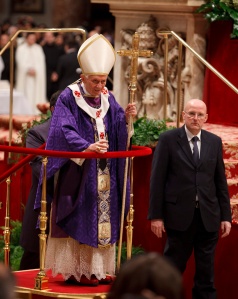Pope leaves on wheeled platform after celebrating Ash Wednesday Mass at Vatican