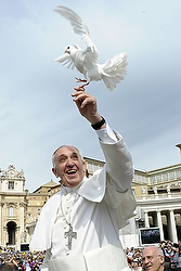 Pope Francis holds a dove before his weekly audience in St. Peter's Square at the Vatican May 15. (CNS photo/L'Osservatore Romano via Reuters) 