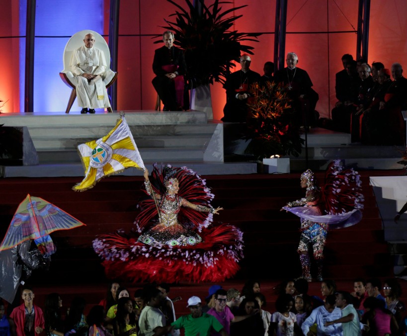 Pope Francis watches as dancers perform during the World Youth Day welcoming ceremony on Copacabana beach in Rio de Janeiro July 25. (CNS photo/Ricardo Moraes, Reuters) (July 25, 2024)
