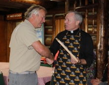Bishop Burns presents John Gitkov with a commemorative plaque for his hard work and determination in saving the Shrine of St. Therese Lodge.