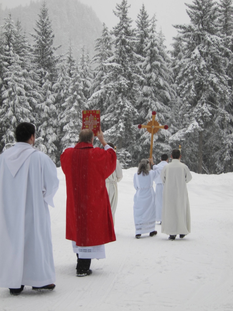 Deacon Charles Rohrbacher carries the book of the Gospels at the beginning of the procession from St. Peter's Hall into St. Paul the Apostle church for the opening mass of the Diocese of Juneau Synod 2013.