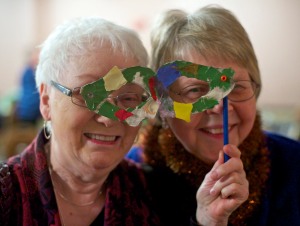 Tisket Seslar, left, and Sister Dee Sizler tryout a mask together at the Mardi Gras Masquerade Gala at the Baranof Hotel on Friday. The Gala, a fundraiser for the Shrine of St. Therese, included a sit down dinner, live music, silent auction, and outcry dessert auction.  The goal is to raise $25,000 to pay for the Shrine's septic system upgrades.