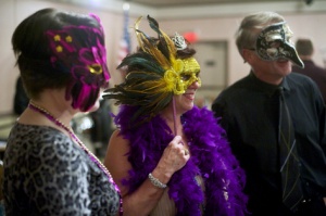 Shrine supporters don masks to support the Shrine of St. Therese at the fundraising auction and Gala, Feb. 21, 2014.  (Photo Michael Penn)