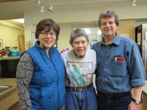 Deacon Vince Hansen and his wife, Jansy, share stories with Haines Assisted Living Facility resident, Lucy Harrell. 