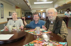 Deacon Hansen visits with Erma Schnabel and Ray Menaker in the Haines Assisted Living dining room.  (Photos by Christine Hansen)