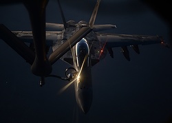 A handout picture made available by the U.S. Department of Defense Aug. 27 shows a U.S. Air Force fighter jet refueling over northern Iraq Aug. 21. Catholic experts are debating the just-war theory in light of the current threat from the Islamic State and past Iraq wars. (CNS photo/Staff Sgt. Shawn Nickel, courtesy U.S. Department of Defense, via EPA)