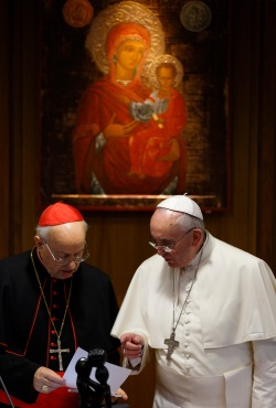Pope Francis talks with Cardinal Baldisseri, general secretary of the Synod of Bishops, during morning session on final day of extraordinary Synod of Bishops on the family at Vatican