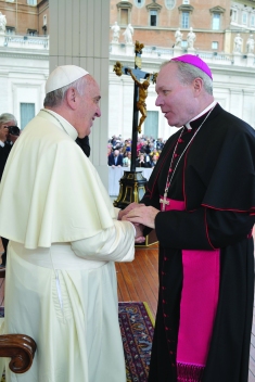 Bishop Edward J. Burns is greeted by Pope Francis on Oct. 29th, 2014, in St. Peter’s Square. Bishop Burns was in Rome with the Diocese of Juneau ‘Partners in Faith’ pilgrimage. 