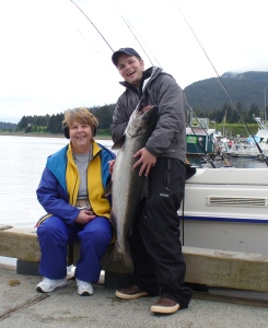 Sr. Dee poses with a  large salmon she caught near Juneau while on a fishing trip with friends.
