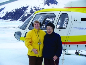 Sisters Dee Sizler (left) and Annina Morgan (right) along with S. Mary Beth Peters and Associate Linda Fry visited Juneau and the five SC Associates living there, taking a helicopter flightseeing tour to the Mendenhall Icefield.