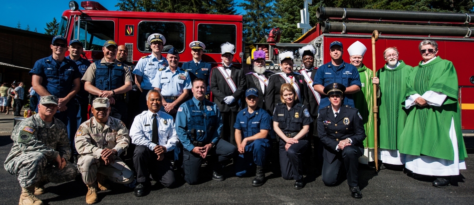 Bishop Edward J. Burns gathers in August of 2013 following the Annual Blue Mass at St. Paul the Apostle Church at which members of law enforcement and safety personnel are honored. 