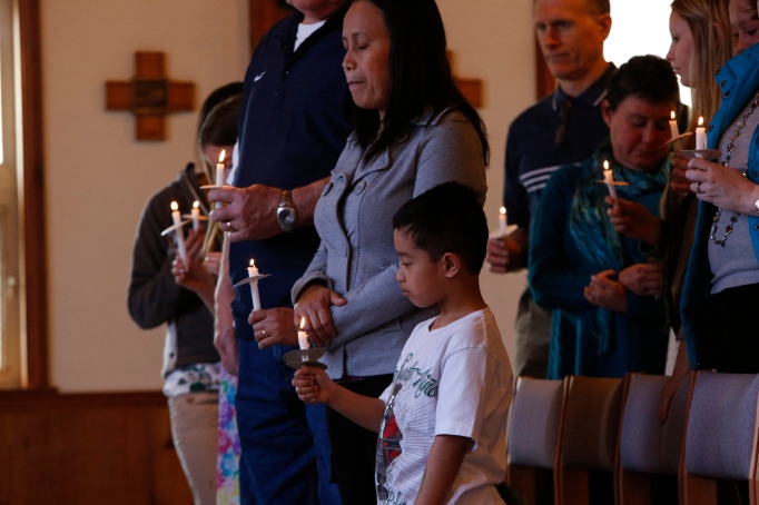 Families gather for Easter Mass at St. John by the Sea Church in Klawock on Prince of Wales Island in southeastern Alaska, April 19, 2014. (CNS photo/Nancy Wiechec) 