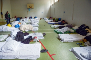 Refugees are temporarily sheltered at Lauttasaari Parish of the Finnish Evangelical Lutheran Church in Helsinki Sept. 14. Finland receives between 200-300 refugees per day from Iraq, Afganistan, Somalia and Albania. (CNS photo/Kimmo Brandt, EPA) 