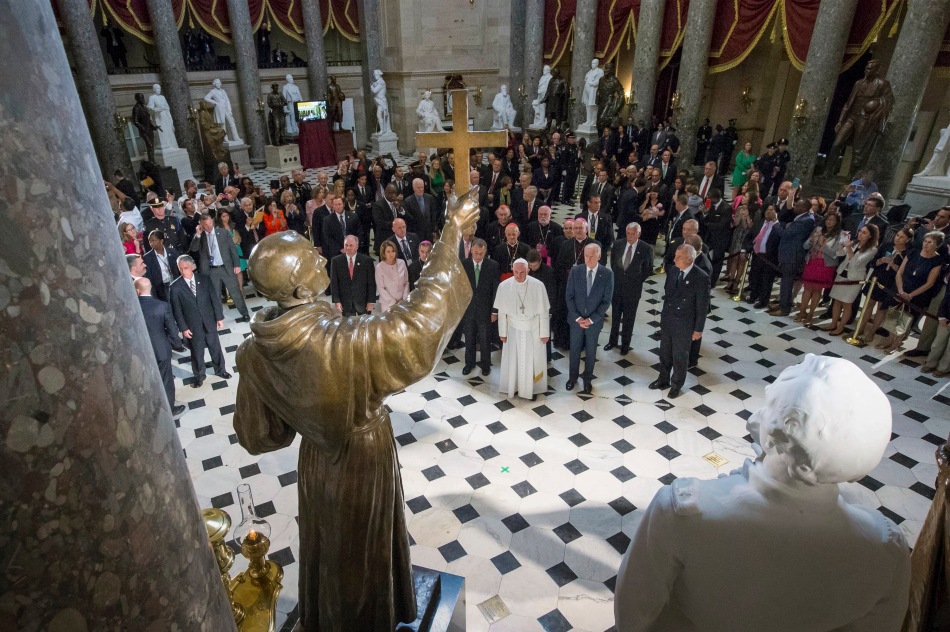 Pope Francis pauses in front of the  sculpture of St. Junipero Serra in Statuary Hall at the U.S. Capitol in Washington Sept. 24. (CNS photo/Michael Reynolds, pool) 