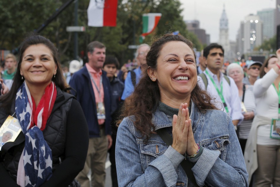 A woman reacts to Pope Francis' final words during the closing Mass of the World Meeting of Families on the Benjamin Franklin Parkway in Philadelphia Sept. 27. (CNS photo/Brian Snyder, Reuters)