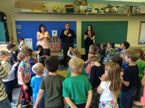 Deacon Mike Galbraith (center)  assists teachers at a Holy Name day camp in Ketchikan. 